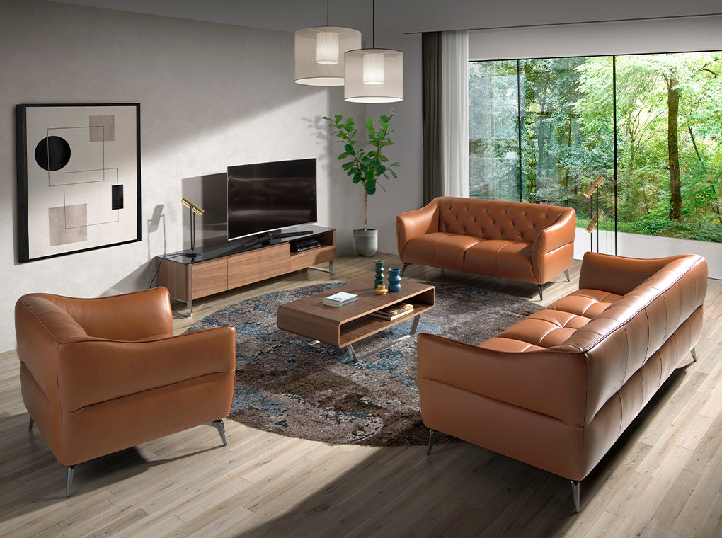 Sillón tapizado en piel marrón con modelo capitoné de Angel Cerdá