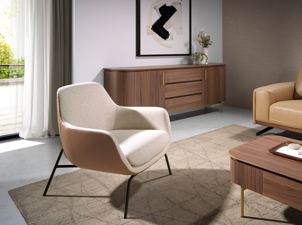 Sillón tapizado con material textil y piel ecológica con estructura de acero negro