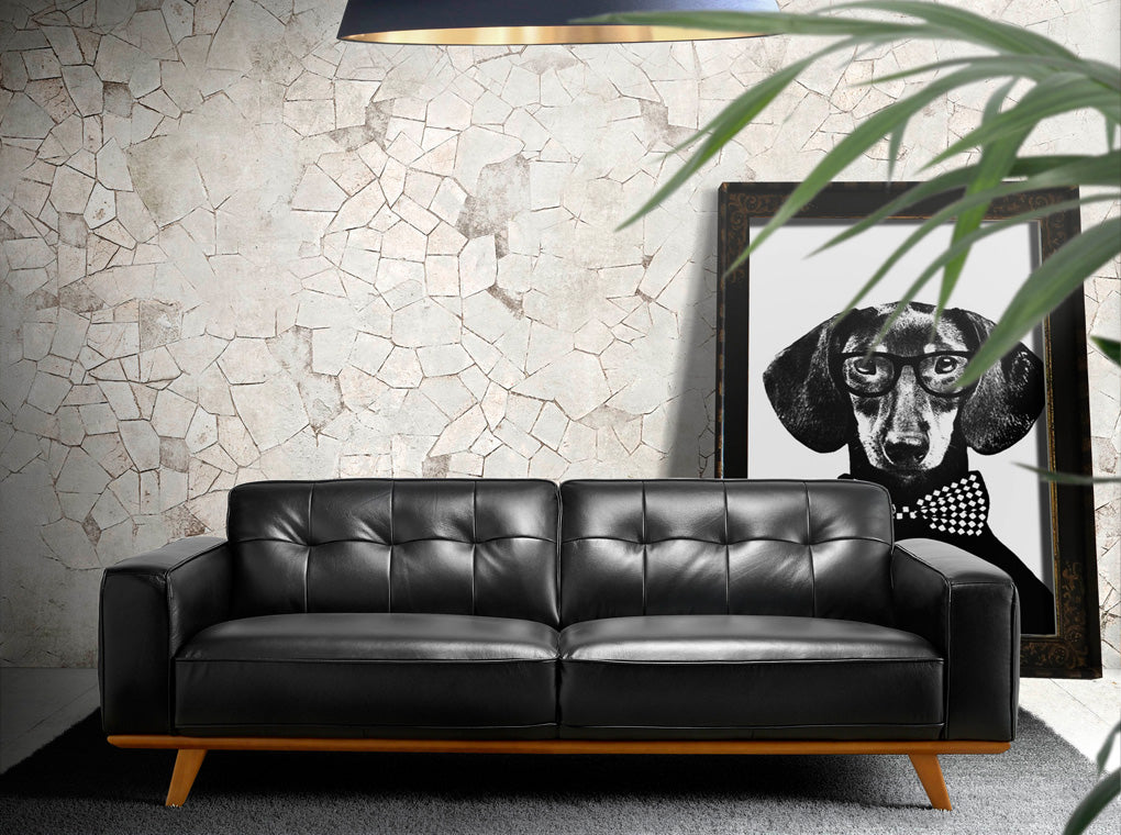 Sofá de tres plazas tapizado en piel negra Angel Cerdá