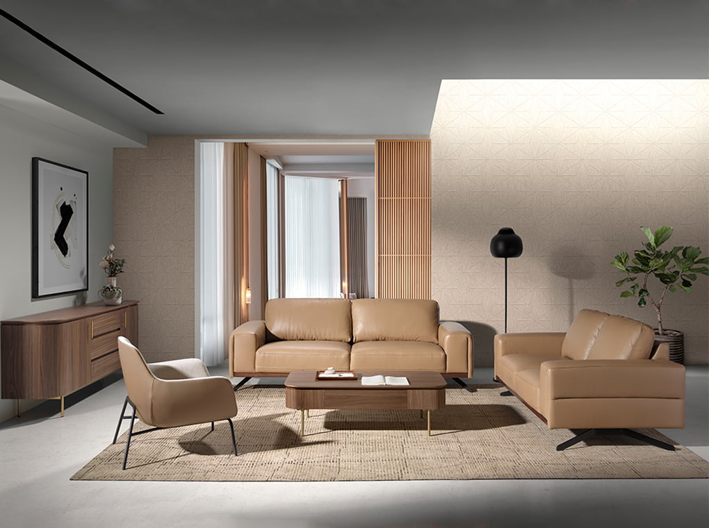 Sofá de dos plazas tapizado en piel de color arena de Angel Cerdá