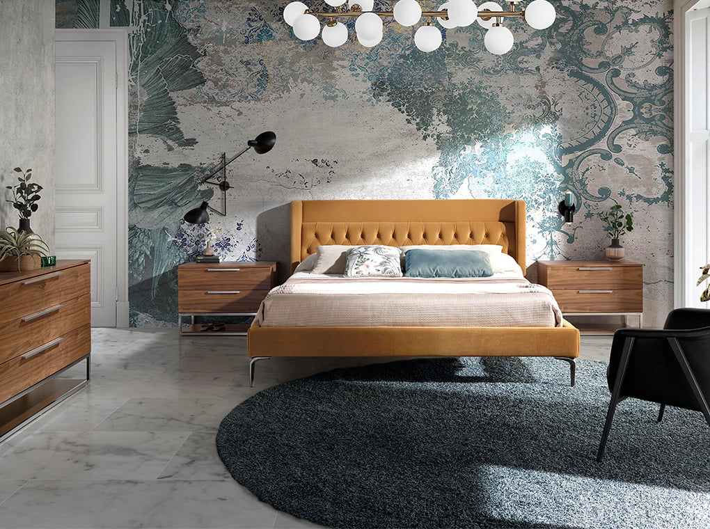 Cama doble tapizado con material aterciopelado matelassé Angel Cerdá.