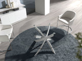 Mesa de comedor redonda de vidrio con patas de acero 140x95cm Angel Cerdá