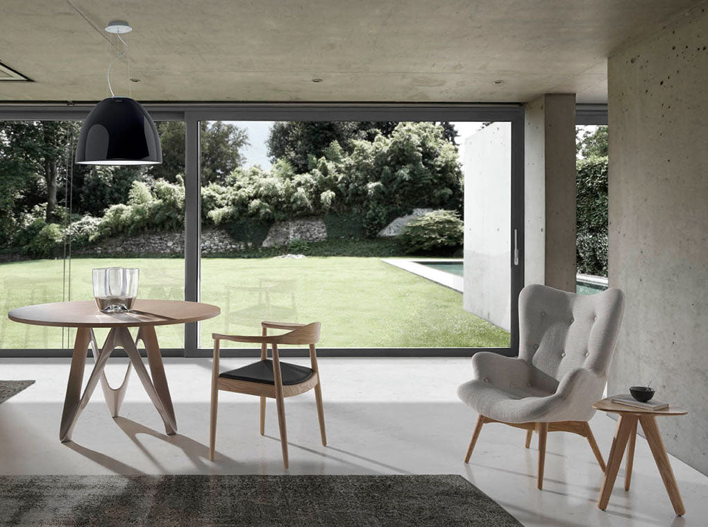 Sillón tapizado con material textil con acabado capitoné Angel Cerdá