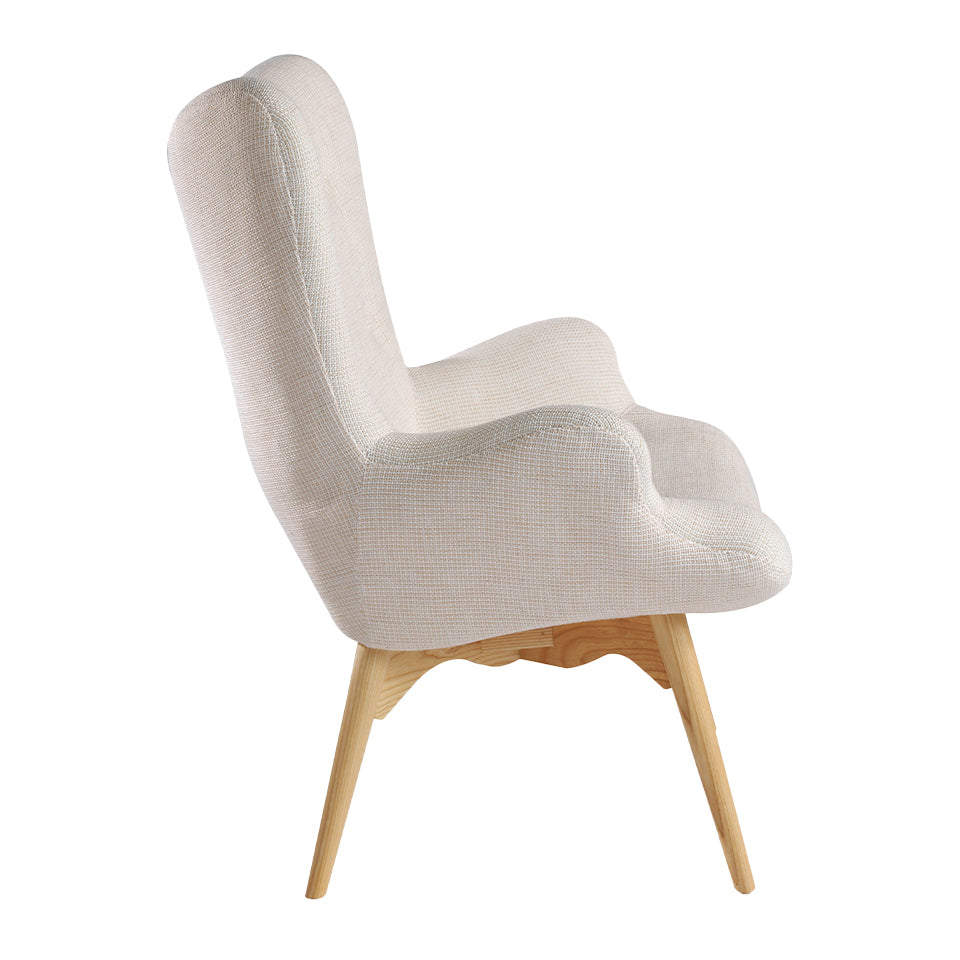 Sillón tapizado con material textil con acabado capitoné Angel Cerdá