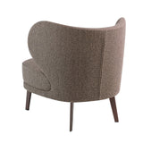 Sillón tapizado en material marrón Vello de Angel Cerdá
